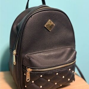Chic Black Leather Backpack with Gold Accents